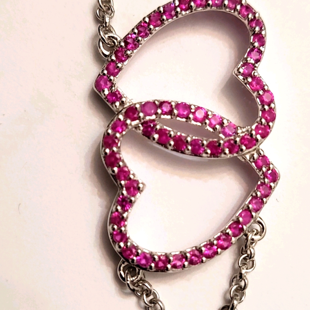 Pink sapphire linked heart bracelet.